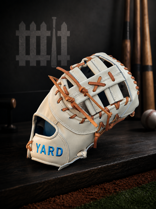 Baseball glove with 'YARD' branding on a wooden surface with dark background